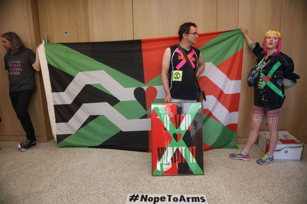 Members Of The Nope To Arms Collective Pull And Collect Their Art Work On Show At The Design Museum In Protest Against The Museum's Involvement With The Weapons Company Leonardo